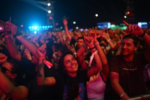 Fans enjoy the Senegalese-American singer Akon's concert during the Rock in Rio music festival in the Rio 2016 Olympic Park in Rio de Janeiro,...