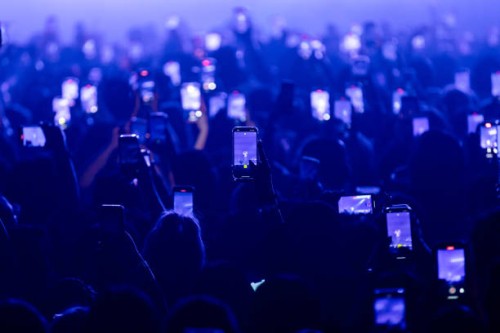 Fans hold up their phones and record as Kehlani performs onstage at Byline Bank Aragon Ballroom on September 06, 2024 in Chicago, Illinois.