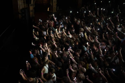 Fans light up the stage with their phone torches whlst Mac Demarco performs at Hackney Empire on July 30, 2023 in London, England.
