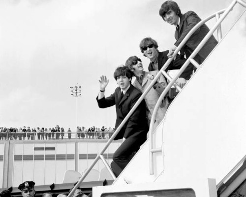 Fans line the rooftop at Kennedy International Airport for a last glimpse of the Beatles -- Paul McCartney, Ringo Starr, John Lennon, and George...