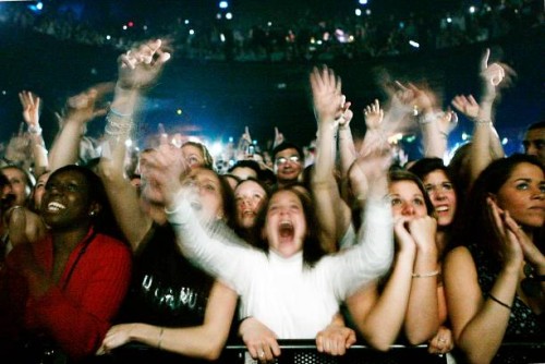 Fans listen to French rap singer Diam's performing on stage, 26 May 2006 at the Olympia in Paris. AFP PHOTO OLIVIER LABAN-MATTEI