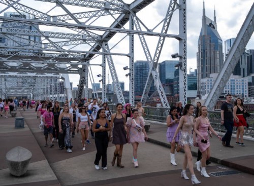 Fans make their way across the People's Bridge to Nissan Stadium ahead of artist Taylor Swift's second night of performance on May 6, 2023 in...
