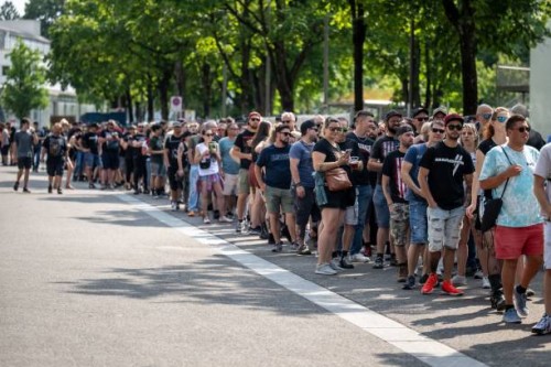 Fans of Rammstein music band queue to attend band's concert at Wankdorf Stadium in Bern on June 17, 2023. Several women have come forward recently to...