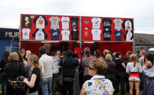 Fans queue to buy Kings of Leon merchandise before the concert at Murrayfield Stadium in Edinburgh.Stadium