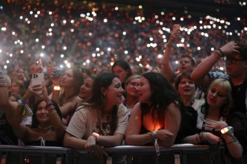 Fans react as Taylor Swift performs onstage during "Taylor Swift | The Eras Tour" at Johan Cruijff Arena on July 05, 2024 in Amsterdam, Netherlands.