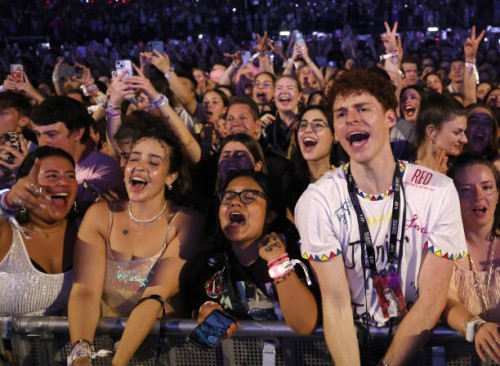 Fans watch Taylor Swift performs onstage during night four of "Taylor Swift | The Eras Tour" at La Defense on May 12, 2024 in Paris, France.