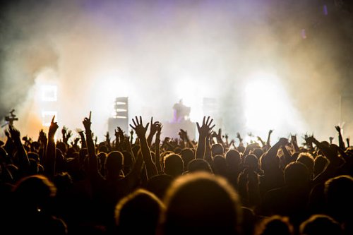fans with raised arms at music festival - concert stock pictures, royalty-free photos & images