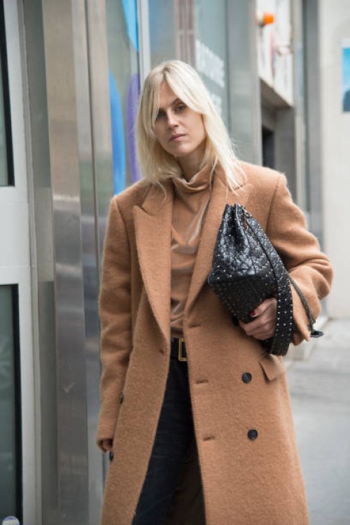 Fashion blogger Linda Tol wears a Salle Privee coat, Valentino bag and MSGM sweater day 6 of Paris Womens Fashion Week Spring/Summer 2018, on October...