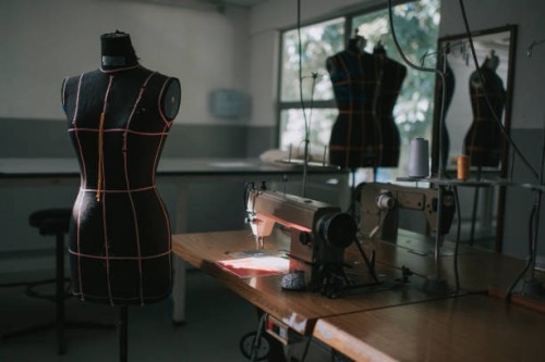 fashion design college classroom workshop with sewing machine - fashion stock pictures, royalty-free photos & images