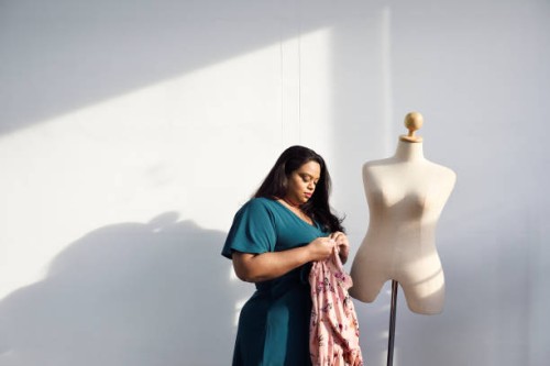 fashion designer dressing a mannequin - fashion stock pictures, royalty-free photos & images