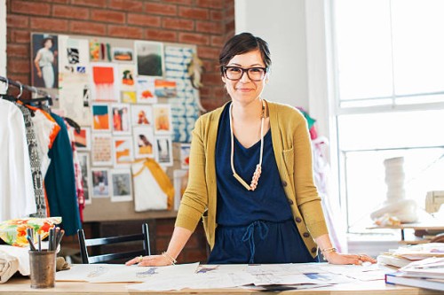 fashion designer in her studio - fashion stock pictures, royalty-free photos & images