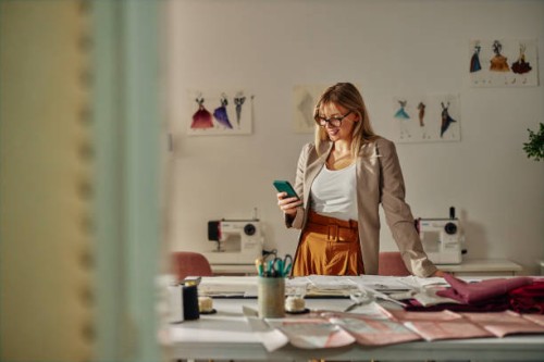 fashion designer typing message to client - fashion stock pictures, royalty-free photos & images