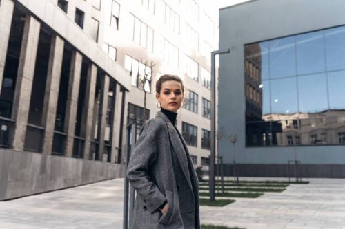 fashion editorial style pictures of a beautiful girl exploring the raw spaces of a city - fashion stock-fotos und bilder