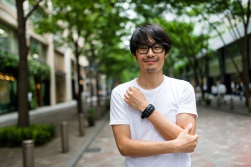 fashion japanese adult man walking - fashion stock pictures, royalty-free photos & images