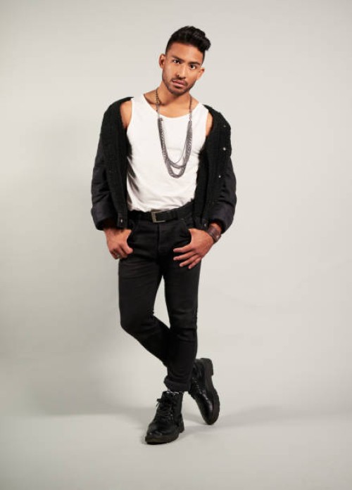 fashion, model and man from mexico in a studio posing for a luxury clothes brand. portrait of a gen z, tough and cool look and pose of a young male person in rich designer style clothing for trends - fashion stock pictures, r