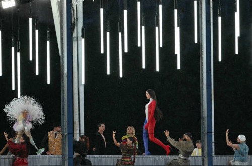 Fashion model displays creations while walking a catwalk erected along the Passerelle Debilly bridge on the Seine river during the opening ceremony...