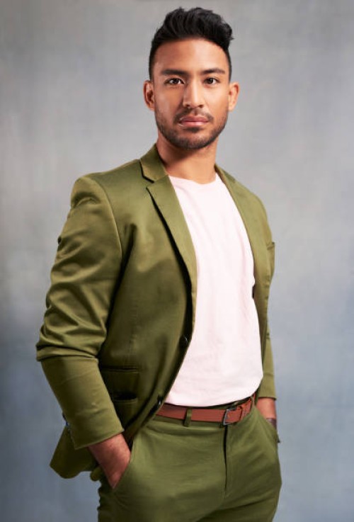 fashion model portrait, sexy young man with hands in pocket and studio on grey background. casual cool latino person with trendy suit jacket with stylish white shirt and modern professional style - fashion stock pictures, roy