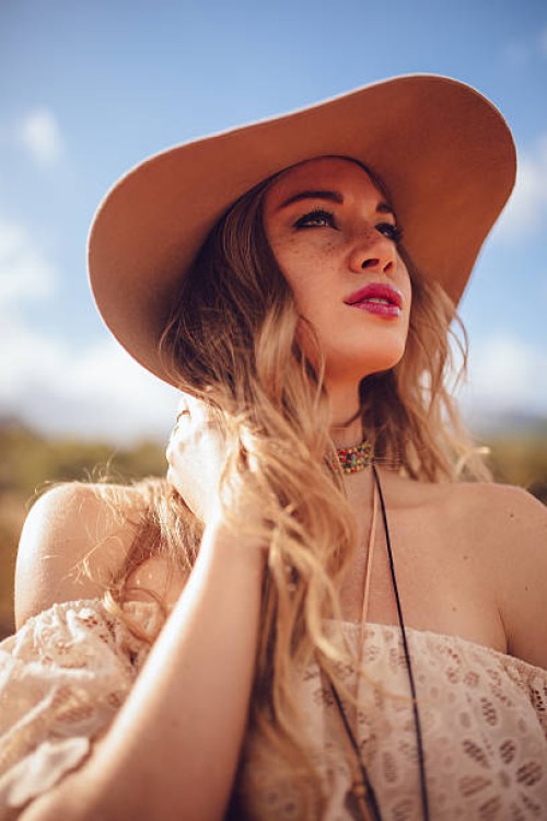 fashion shot of a boho girl wearing a felt hat - fashion stock pictures, royalty-free photos & images