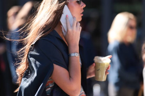 Fashion Week guest is seen wearing sunglasses, several rings, a dark blue shirt, and a silver watch from Cartier before the Ulla Johnson Show during...