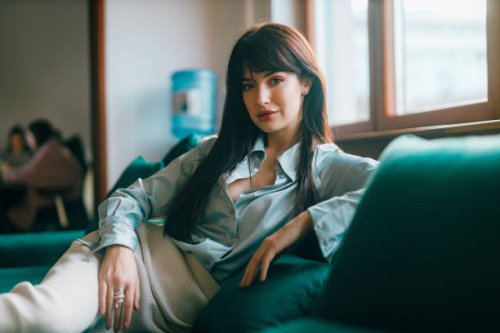 fashionable businesswoman sitting in the modern start-up office - hairstyle stock pictures, royalty-free photos & images