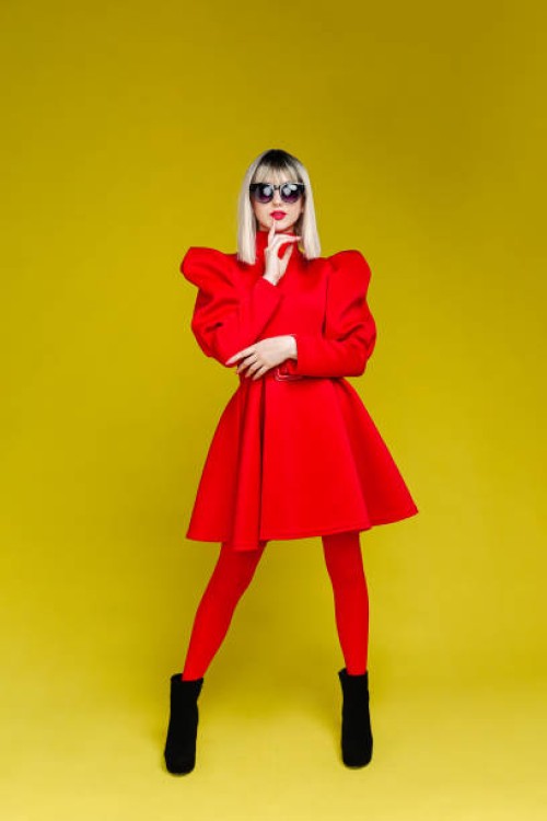fashionable woman dresses in red - fashion stock pictures, royalty-free photos & images