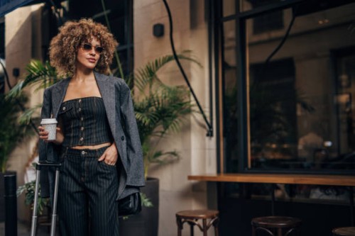 fashionable woman enjoying coffee in the city - fashion stock pictures, royalty-free photos & images