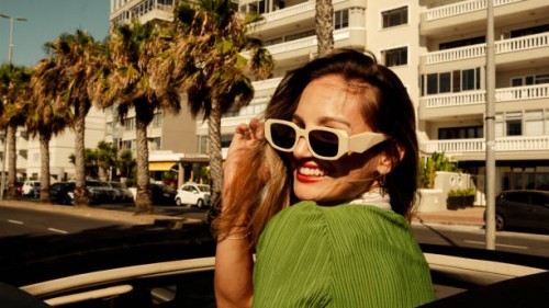 fashionable woman in green dress living her dreams - fashion stock pictures, royalty-free photos & images