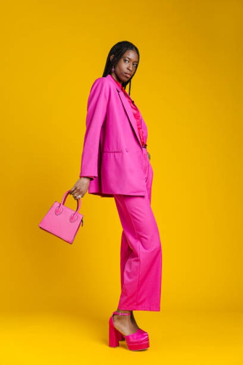 fashionable woman in pink suit - fashion stock pictures, royalty-free photos & images