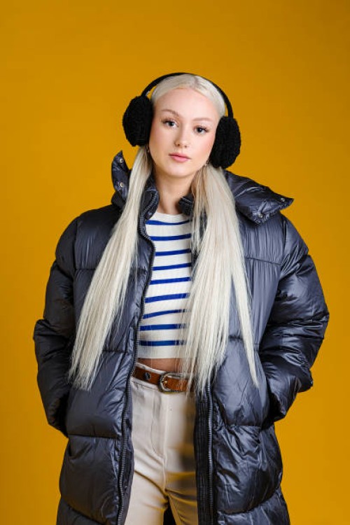 fashionable woman in puffy winter coat - fashion stock pictures, royalty-free photos & images