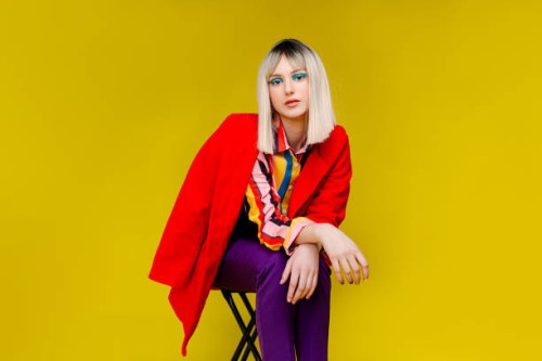 fashionable woman in red coat - fashion stock pictures, royalty-free photos & images