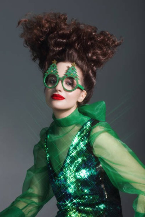 fashionable woman wearing funny christmas party glasses - hairstyle stock pictures, royalty-free photos & images
