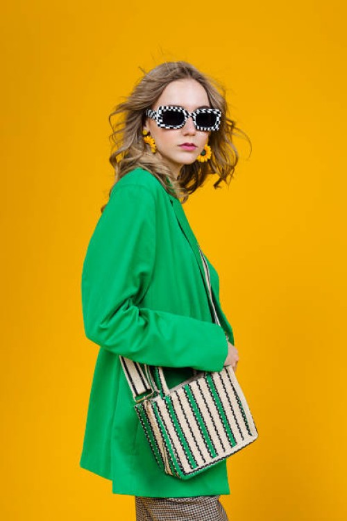 fashionable woman wearing green blazer - fashion stock pictures, royalty-free photos & images