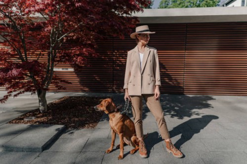 fashionable woman with her dog in the city - fashion stock pictures, royalty-free photos & images