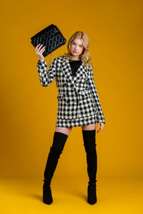 fashionable young woman in front of plain background - fashion stock pictures, royalty-free photos & images