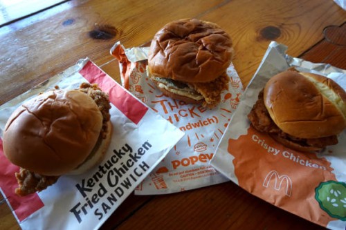 Fast-food chicken sandwiches from McDonald's, Popeyes Louisiana Kitchen and KFC are shown on May 06, 2021 in Chicago, Illinois. Chicken prices have...