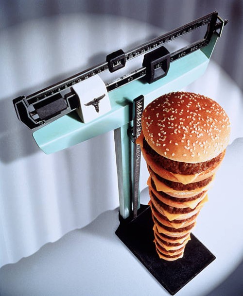 fast food / calories stacking up - junk food stock pictures, royalty-free photos & images