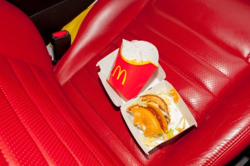 Fast food in the interior of the Mustang owned by fanatic Frederic Henin. Thousands of ordinary people across Europe share extraordinary connections...