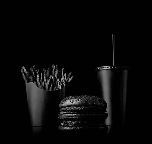 fast food meal on black backdrop - junk food stock pictures, royalty-free photos & images