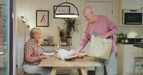 fast food, takeaway and senior couple with dinner at table for eating lunch, supper or meal together. marriage, retirement and elderly man and woman with takeout for hunger, bonding and relaxing - junk food stock pictures, ro