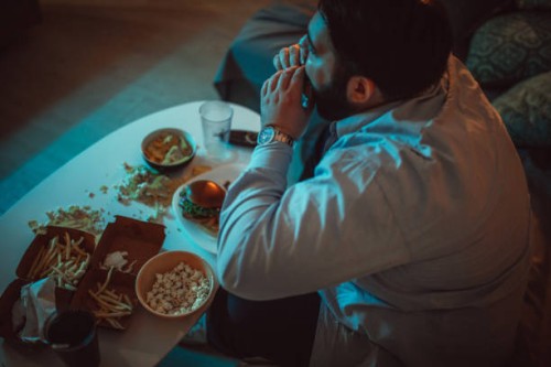 fat man eating fast food - junk food stock pictures, royalty-free photos & images