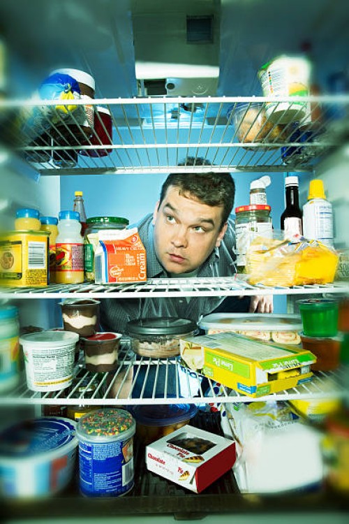 fat man raiding the refrigerator - junk food stock pictures, royalty-free photos & images