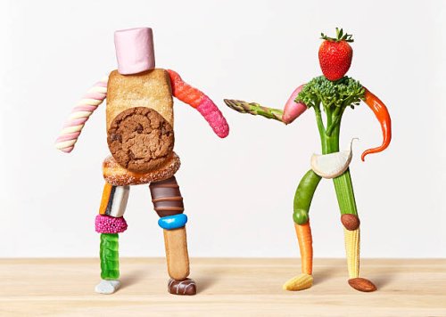 fat sweet man and thin vegetable man - junk food stock pictures, royalty-free photos & images