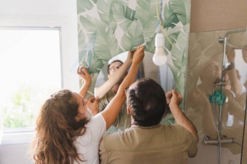 father and daughter decorating together the bathroom at home. do it yourself concept and home interior decoration. - home decoration stock pictures, royalty-free photos & images