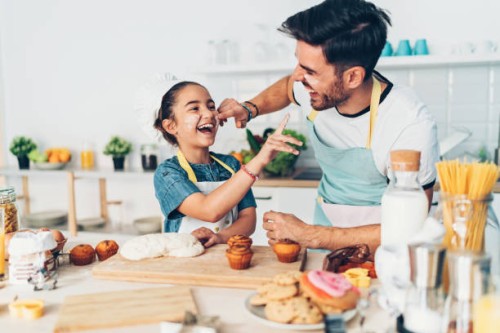 father and daughter having fun in the kitchen - food stock pictures, royalty-free photos & images