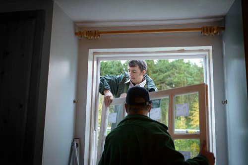 father and son builders installing new window in house - home decoration stock pictures, royalty-free photos & images