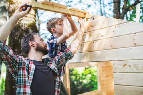 father and son building tree house at backyard - home decoration stock pictures, royalty-free photos & images