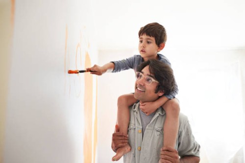 father and son renovating home - home decoration stock pictures, royalty-free photos & images
