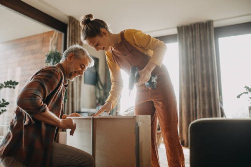 father and teen daughter assembling new furniture in the renovated apartment - home decoration stock pictures, royalty-free photos & images