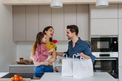 father bring food from restaurant, having diner with wife and daughter at home. family moment after long work day. - junk food stock pictures, royalty-free photos & images