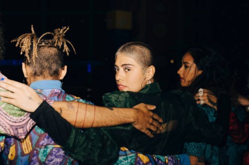 female and male friends with arms around during night - fashion stock pictures, royalty-free photos & images